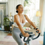Woman Exercising on Stationary Bike
