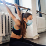 Portrait of a young woman doing exercises at gym